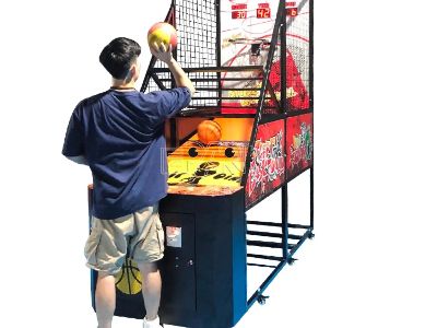 Arcade basketball machine with adjustable difficulty keeps players coming back