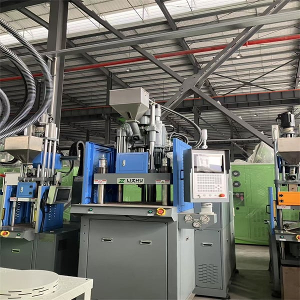Advanced manufacturing with electric vertical injection molding