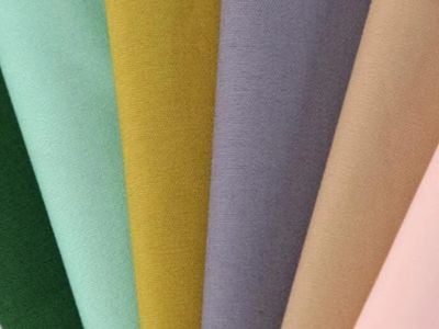 What Makes 100 Polyester Woven Fabric a Reliable Choice for Industrial Use