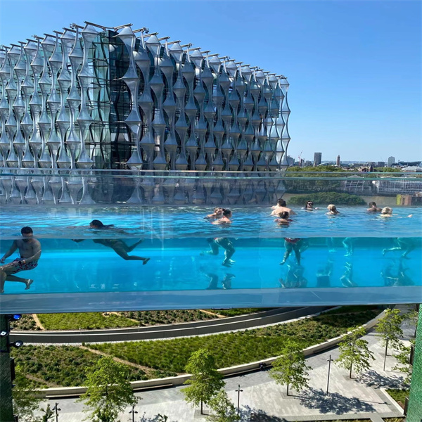 Comparing acrylic wall pool cost to traditional pool expenses.