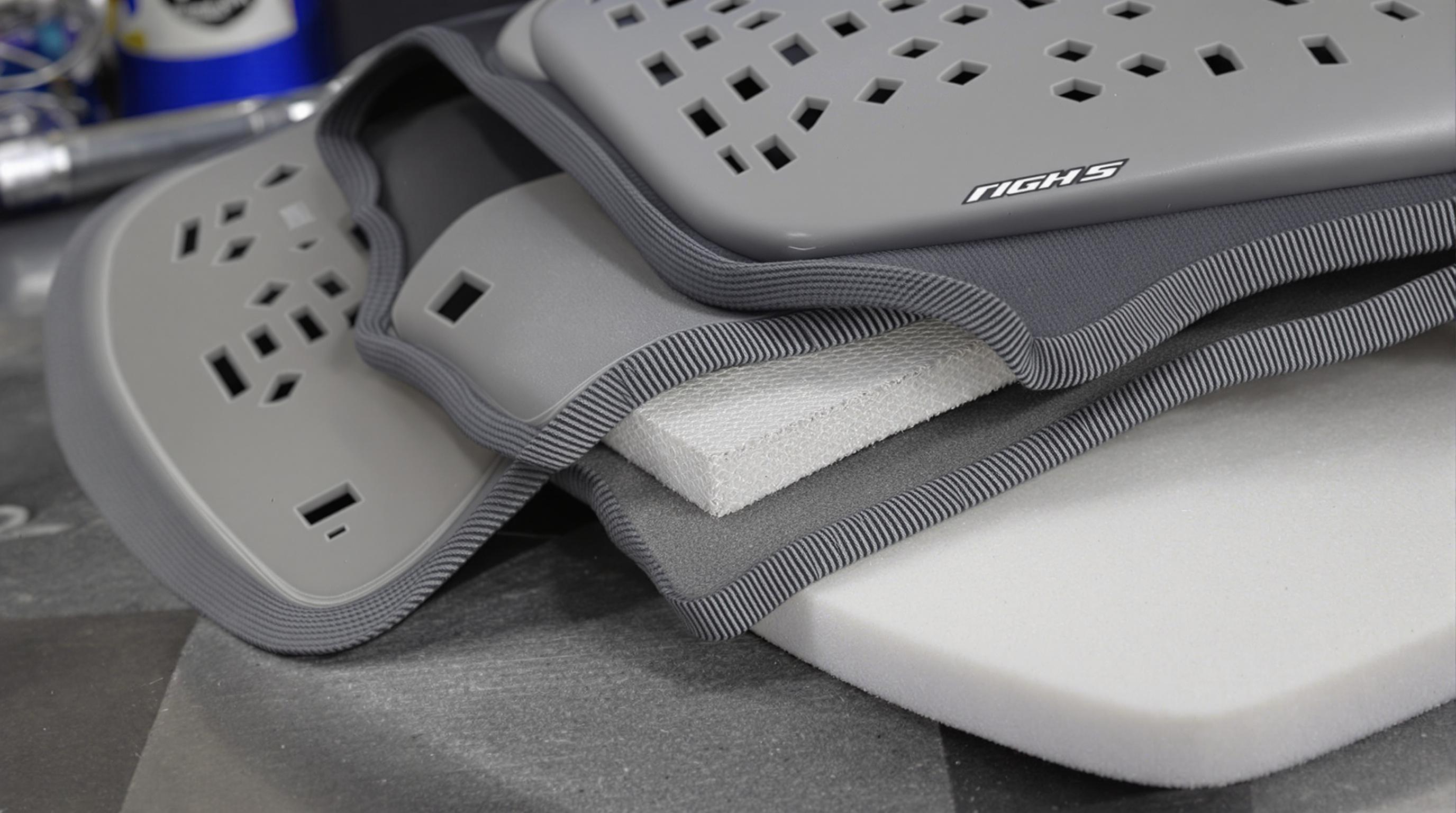 Close-up of back protector material layers including mesh, foam, and honeycomb structure