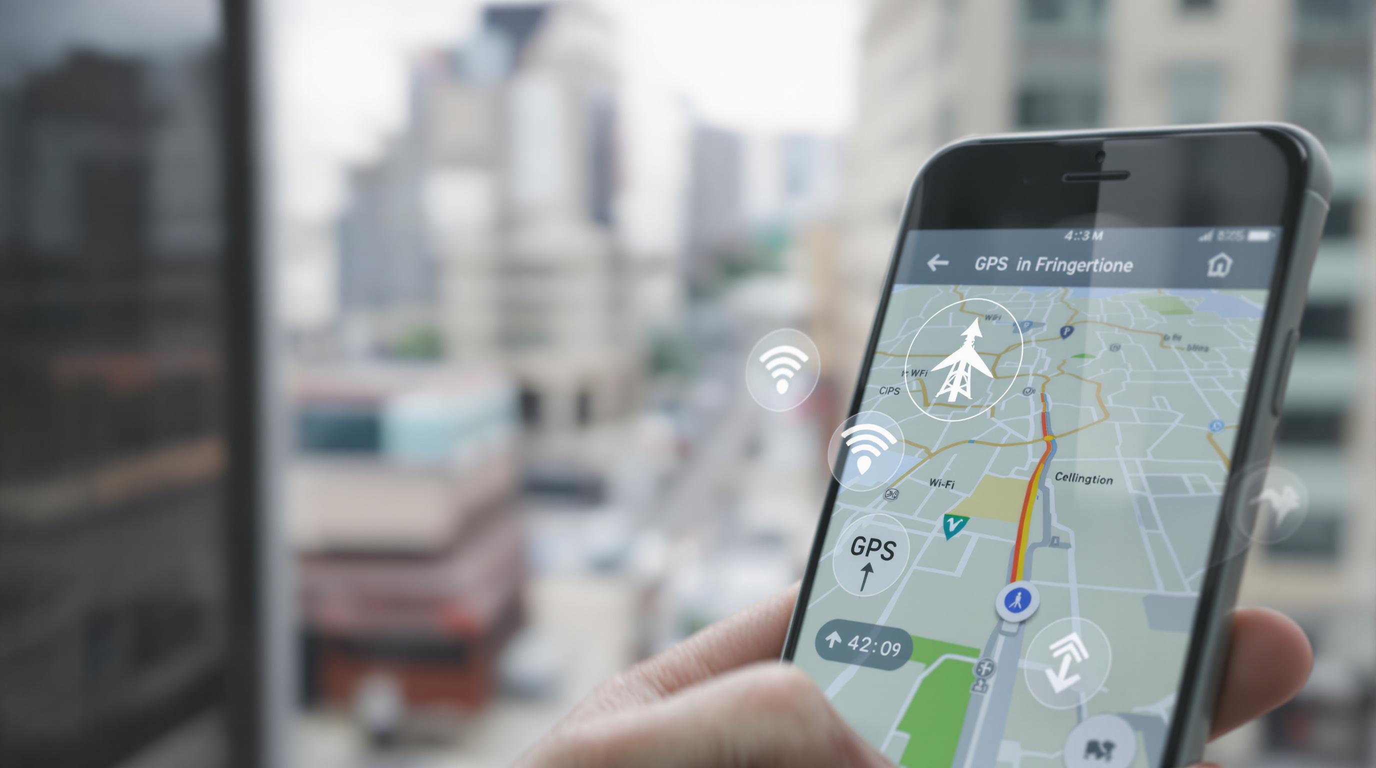 Smartphone showing GPS navigation, with subtle hints of satellite, Wi-Fi, and cellular tracking
