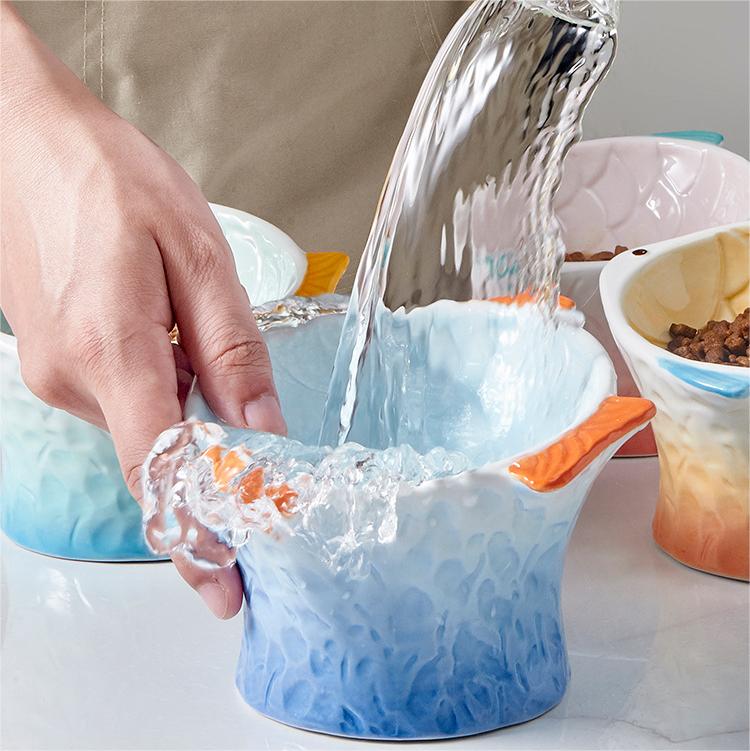 Manufacturer Wholesale Ceramic Novelty products fish shape cat dog two bowls pet bowl supplies Pink blue Yellow Green supplier