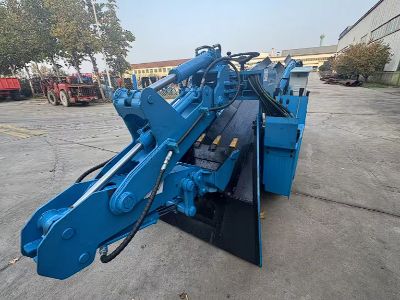 How does auto-lift system prevent tip-over when unloading mining dump trucks