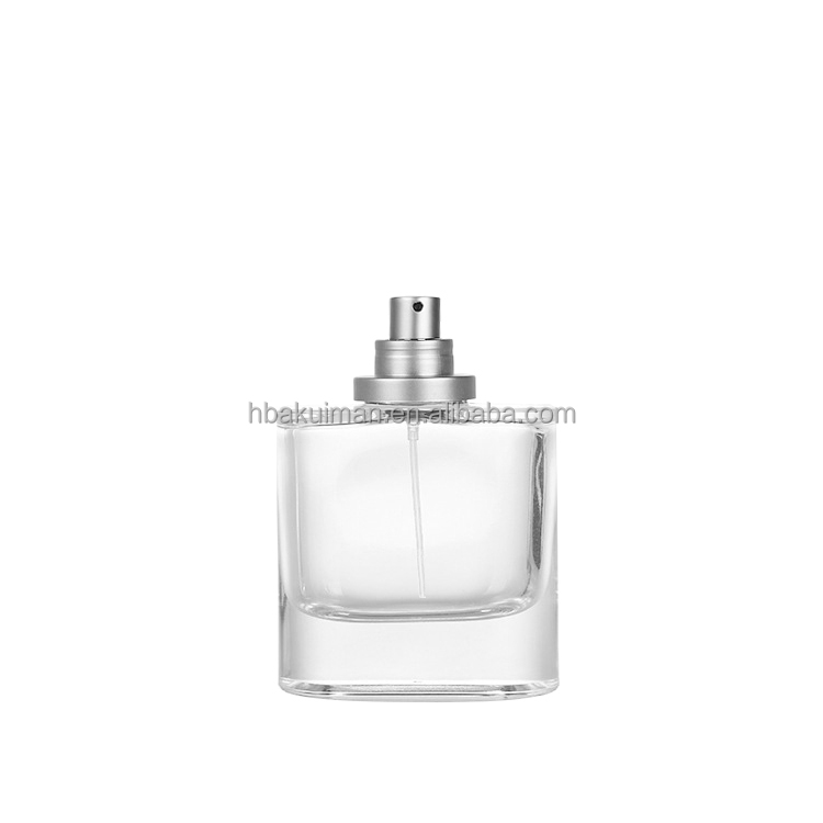 Wholesale Luxury Oval Flat Glass Spray Bottle 60ml 100ml Refillable Men Cologne Perfume Bottle with Crimp Neck manufacture