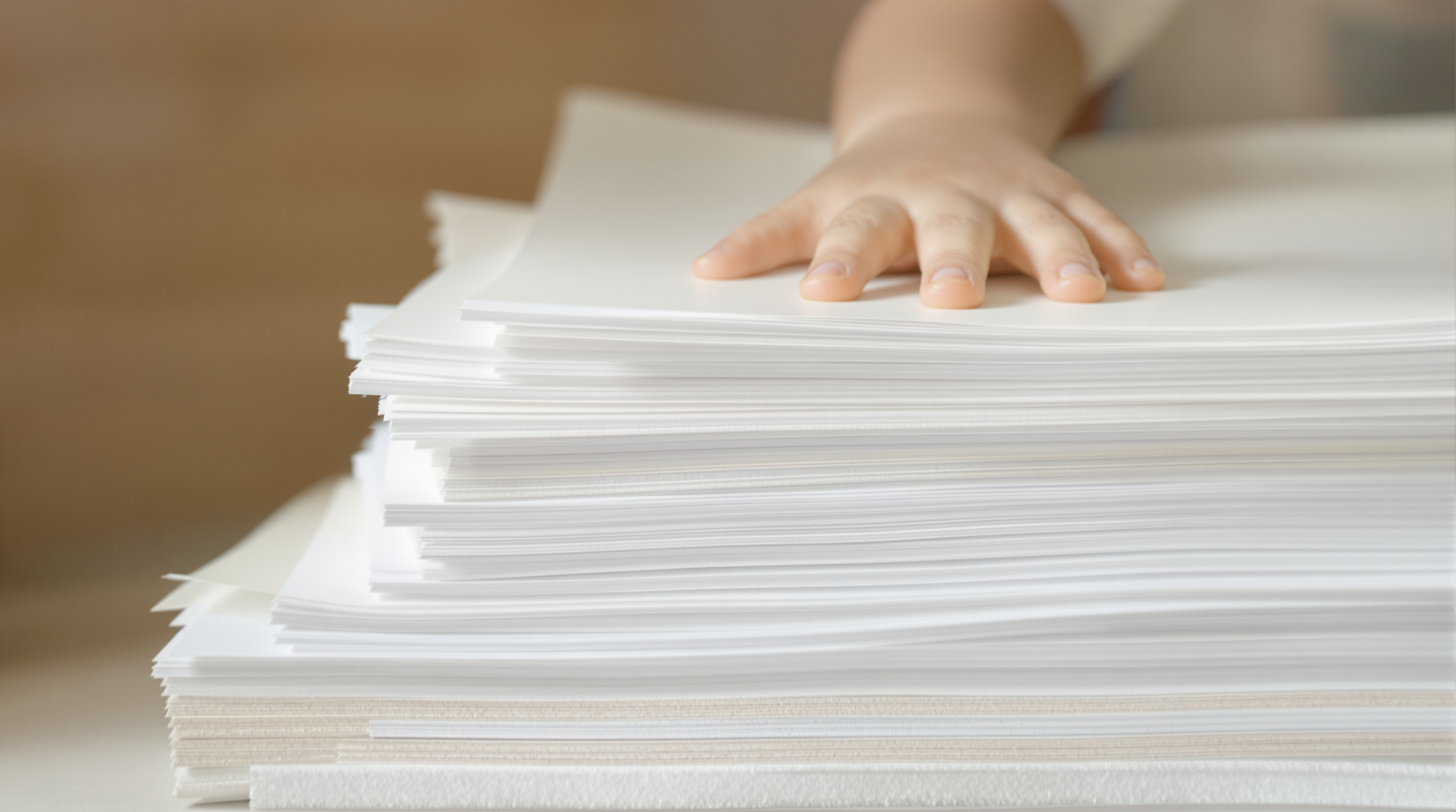 Different types of sustainable paper for children's books being touched by a child