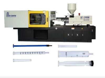 Under what circumstances does an injection molding machine need to be equipped with an air compressor?
