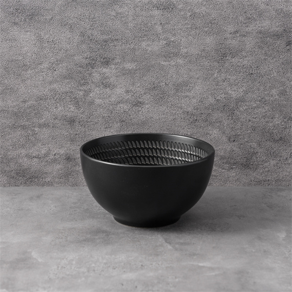 Embrace a modern minimalist look with a black ceramic plate.