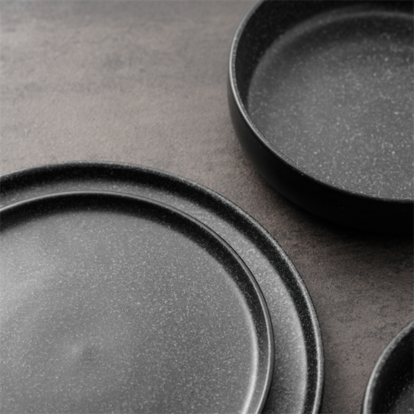This 16-piece black stoneware dinnerware set includes everything you need for a stylish meal.