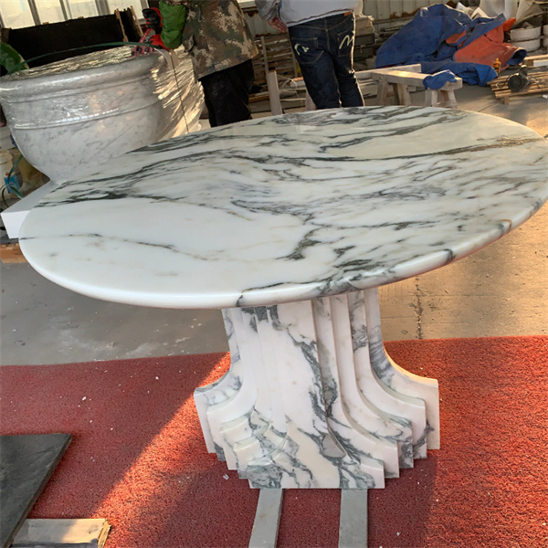 Add a touch of luxury to your furniture collection with our exquisite white marble side table