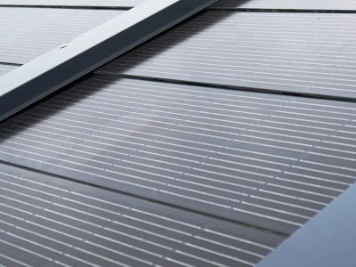 Why are residential solar roof shingles favored by home builders?