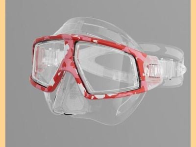 ¿Qué material es el lente, la tapa y el botón de las gafas de buceo?