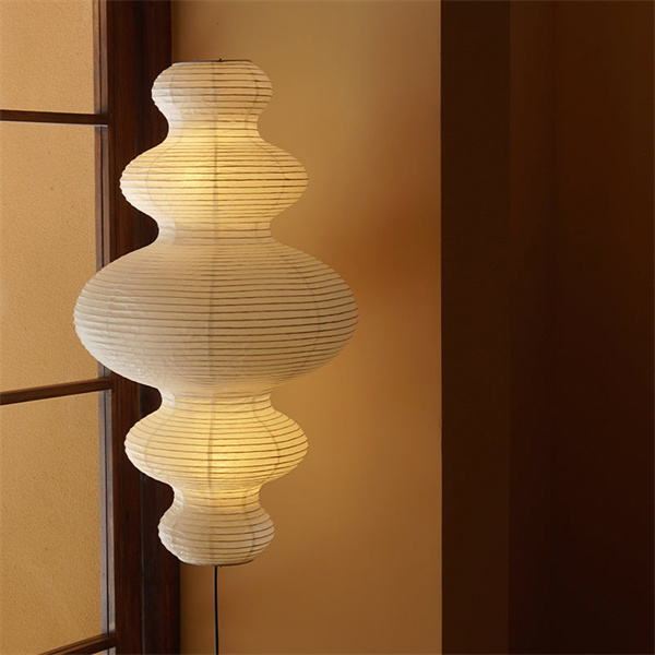 Create a cozy ambiance with a traditional hanging rice paper lamp.