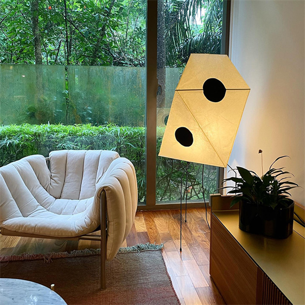 Enhance the ambiance of any room with a stylish and unique rice paper standing lamp