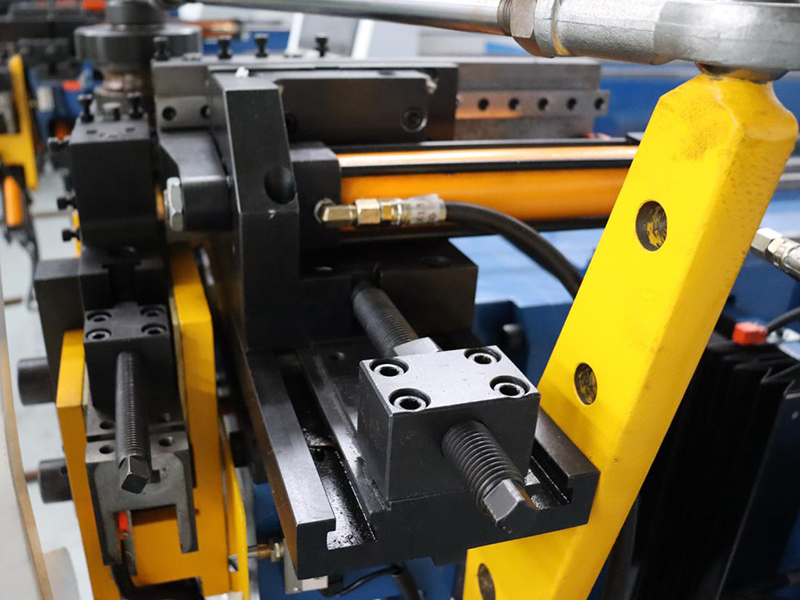 How can lubrication improve the precision of a pipe-bending machine?