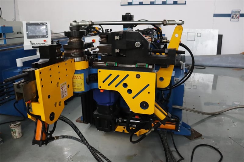 What are the main components of a pipe bending machine?