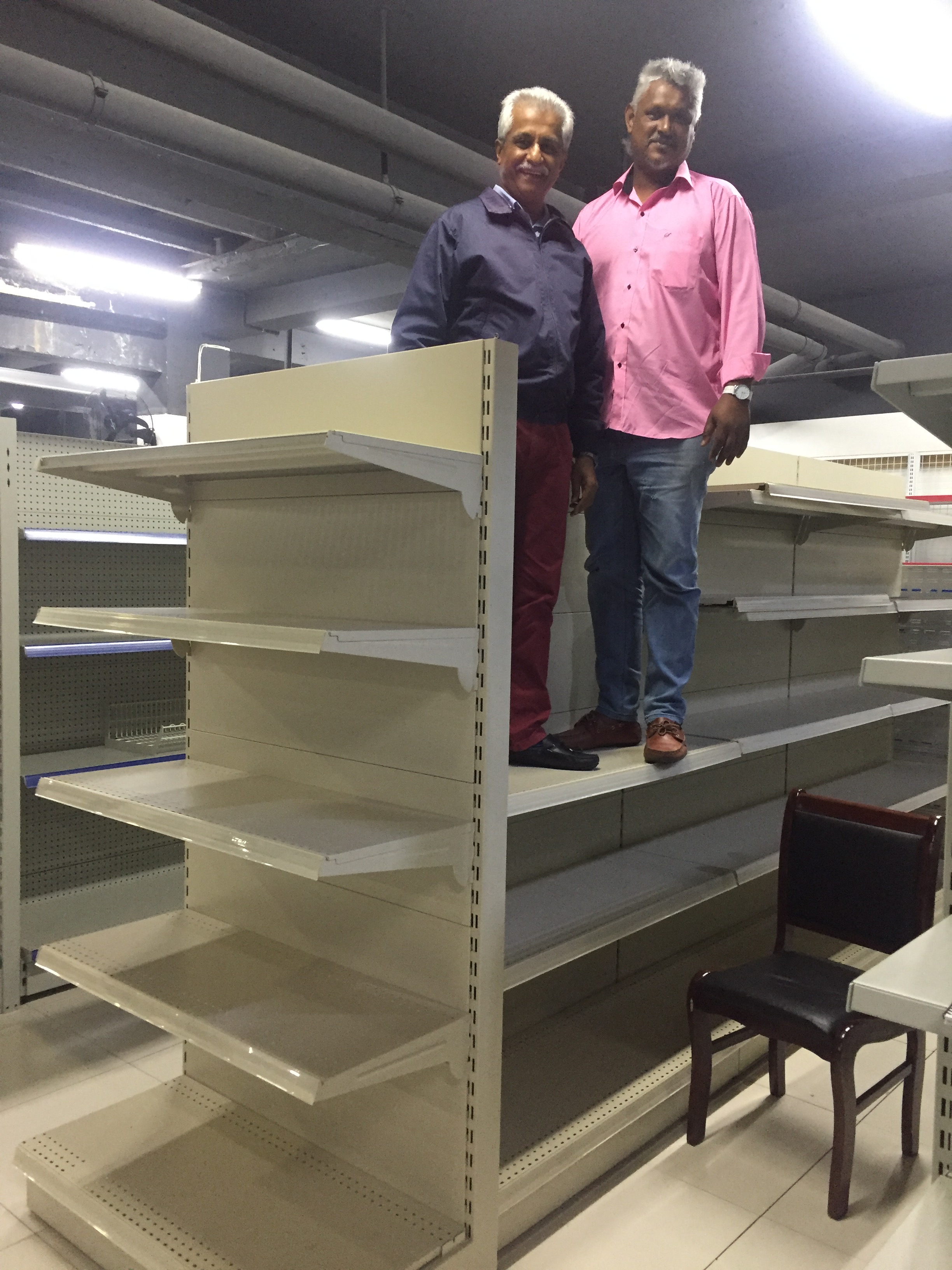How to organize a small retail store using modular supermarket shelf units.