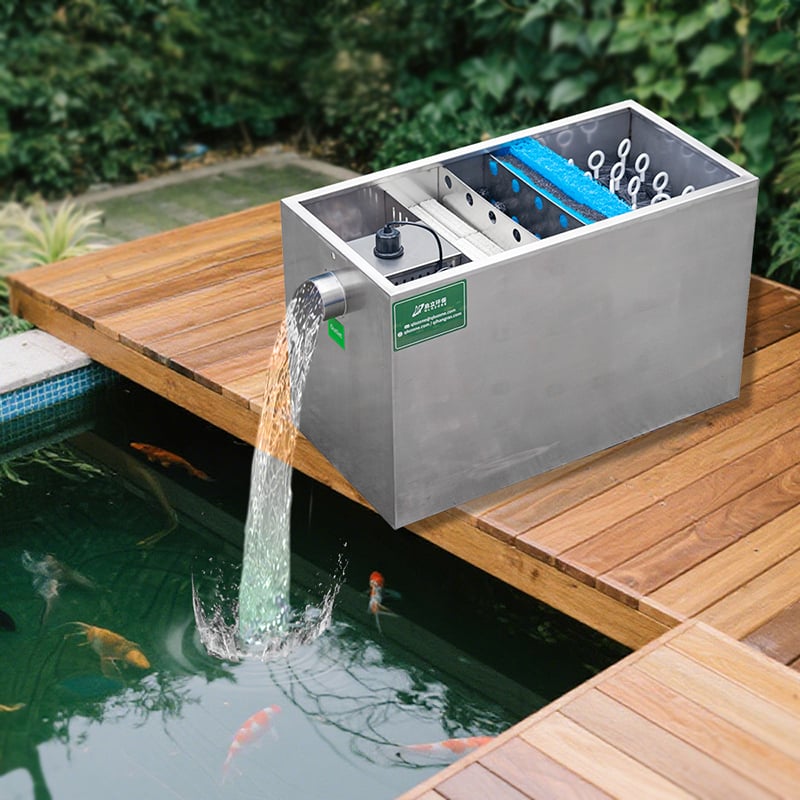stainless steel koi pond filter installed in backyard garden.jpg