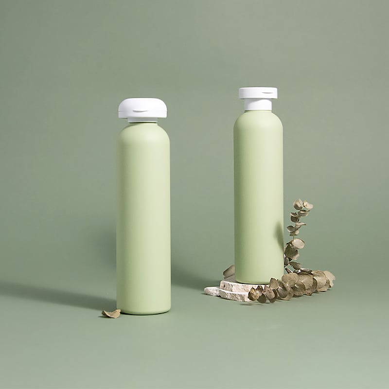 Flacone vuoto per balsamo per capelli con tappo a ribaltina orientabile di colore verde