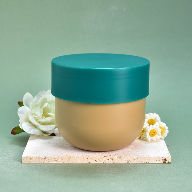Vaso per confezionamento di scrub corpo con coperchio rotante verde e corpo inferiore rotondo marrone