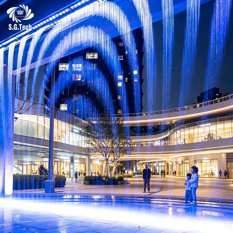 Experience Captivating Digital Graphics with Water Crown's Stainless Steel Water Curtain Display. 