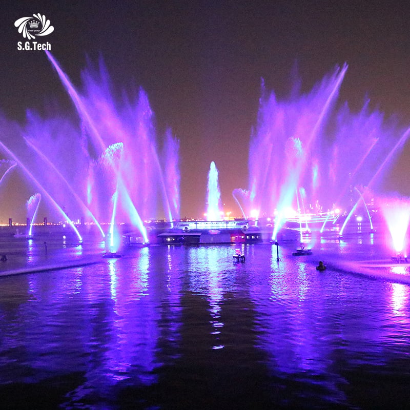 Why do theme parks prefer interactive dancing fountains that squirt water back at guests based on proximity sensors?