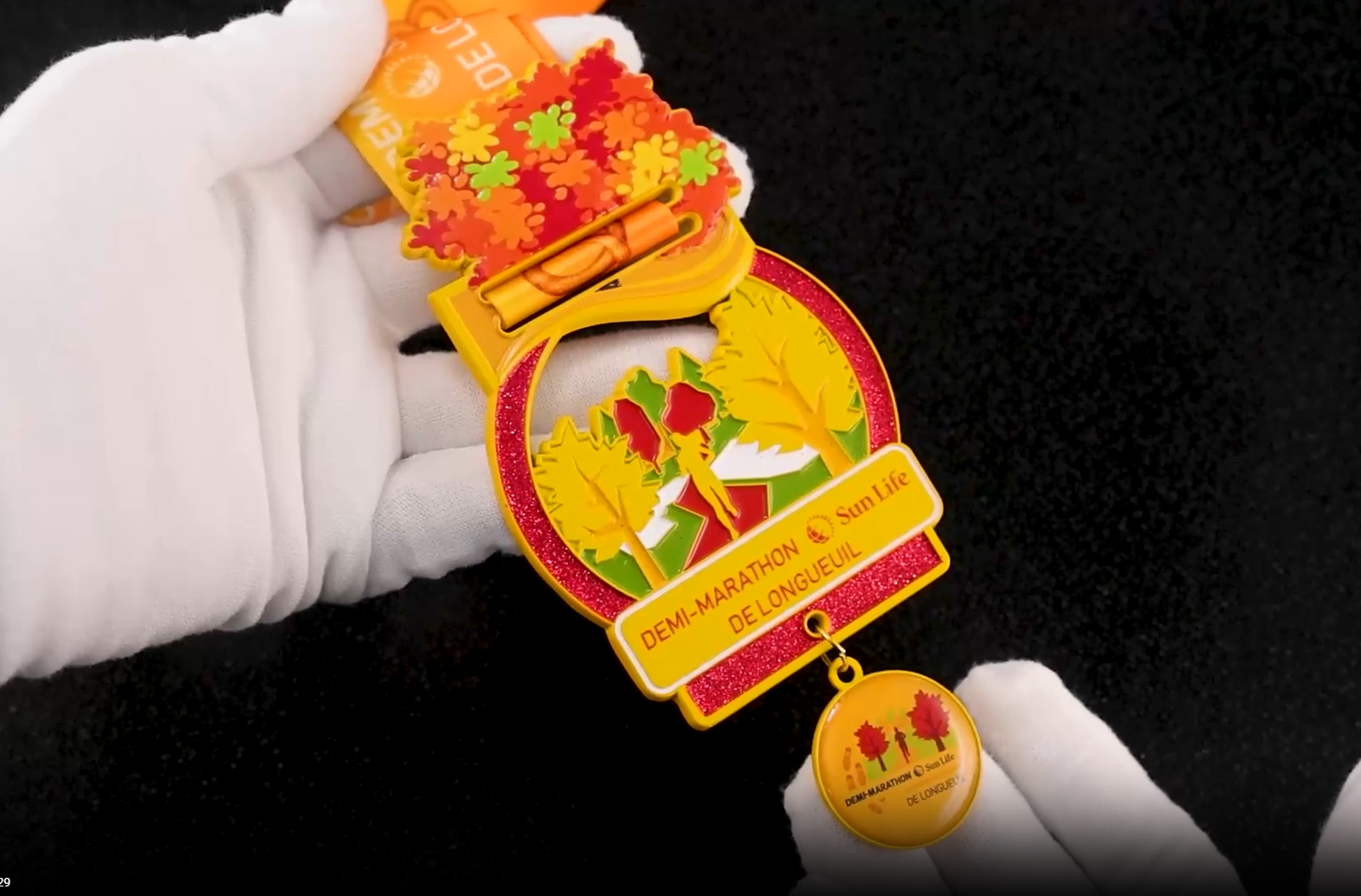 Longueuil Half Marathon: Medal of Autumn Glory - Colorful Maple Leaves & Golden Runner Silhouette on Black