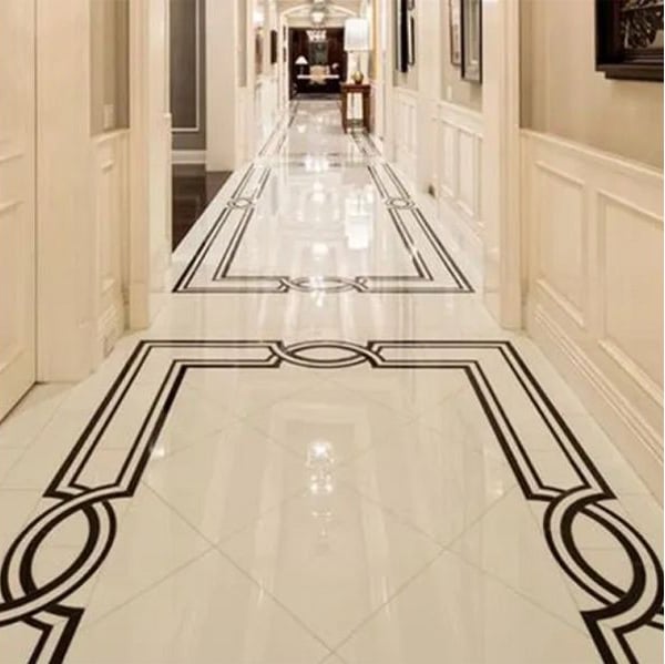 Pavimento in marmo con medaglione realizzato con getto d'acqua per corridoio d'albergo