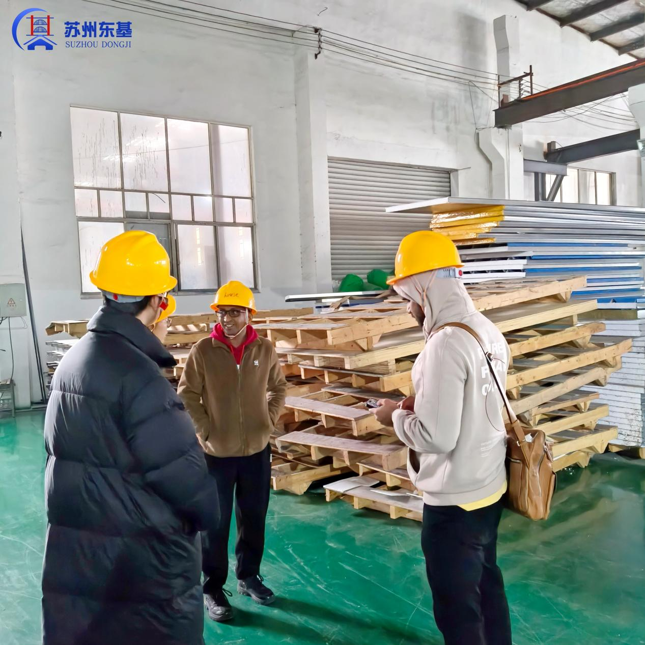 Indian Client Returns for Factory Visit, Places 100-Unit Expandable Triangle-Roof House Order