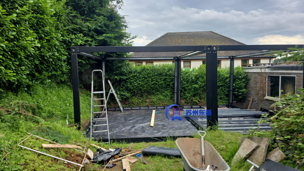 UK Garage Project-Custom Black Prefab Garage with Electric Roller Door
