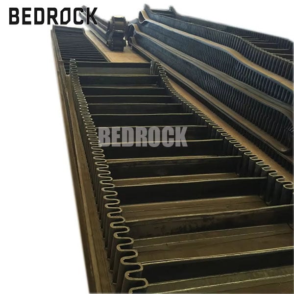 Space Saving Sidewall Conveyor Belt for High Elevation Material Transfer Systems