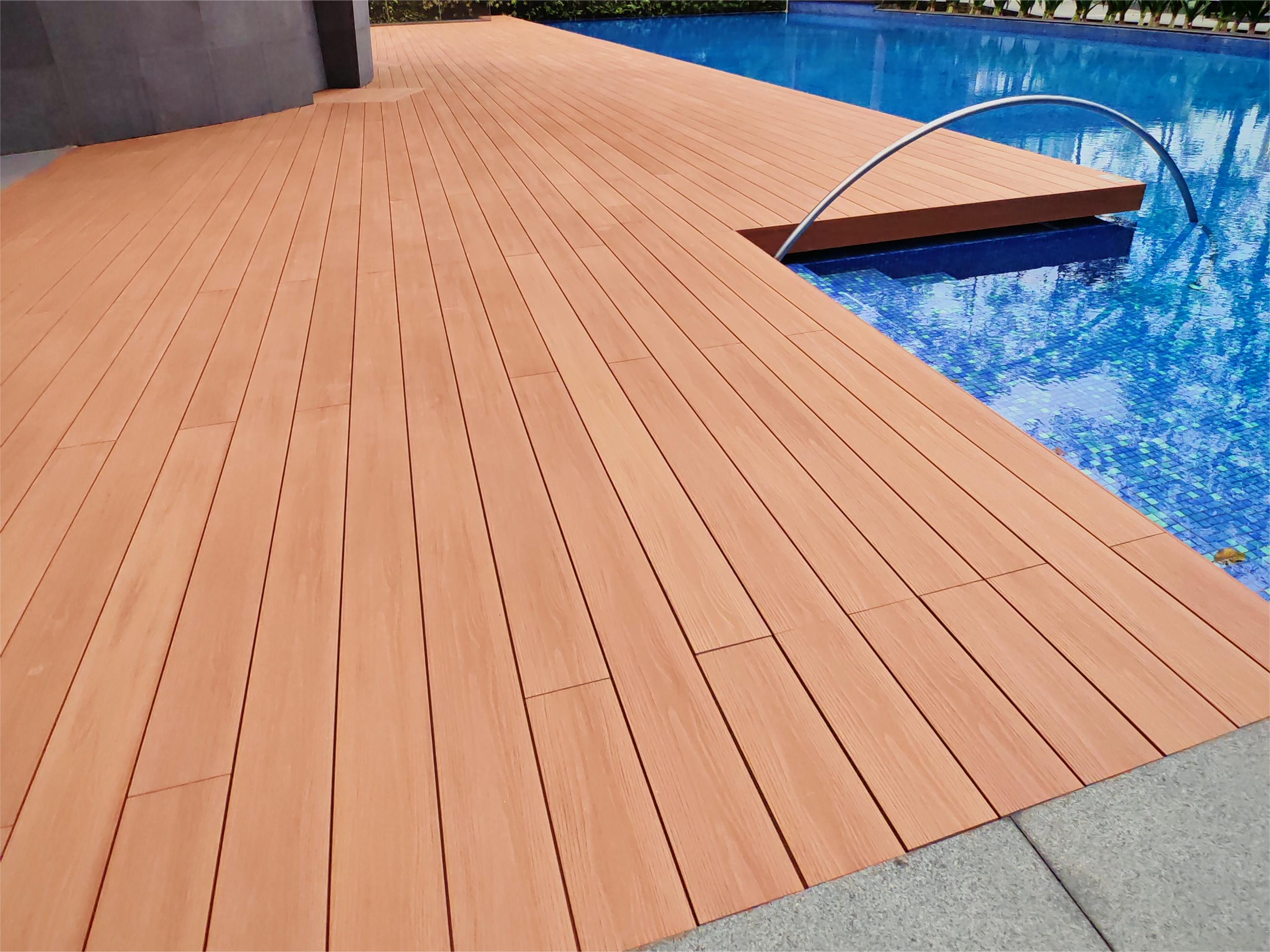 ASA decking at Singapore swimming pool after 12 months exposure - minimal wear, vibrant color retention