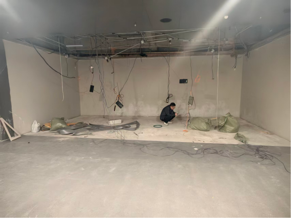 Colorartled engineer planning wiring for a 5-sided immersive LED room in a museum