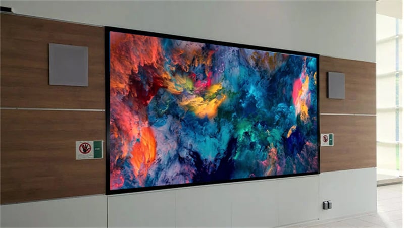 A fully installed 24 square meter P2.5 indoor LED video wall in a luxury corporate lobby, showcasing seamless 4K visual performance and vibrant branding.