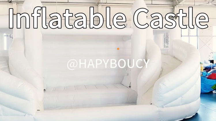 White inflatable double slide with a ball pit