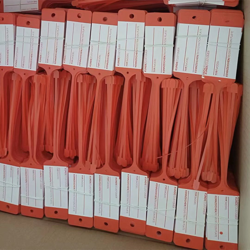 Bulk stock disposable red plastic auto service tags packed in carton, wholesale large shipment.png