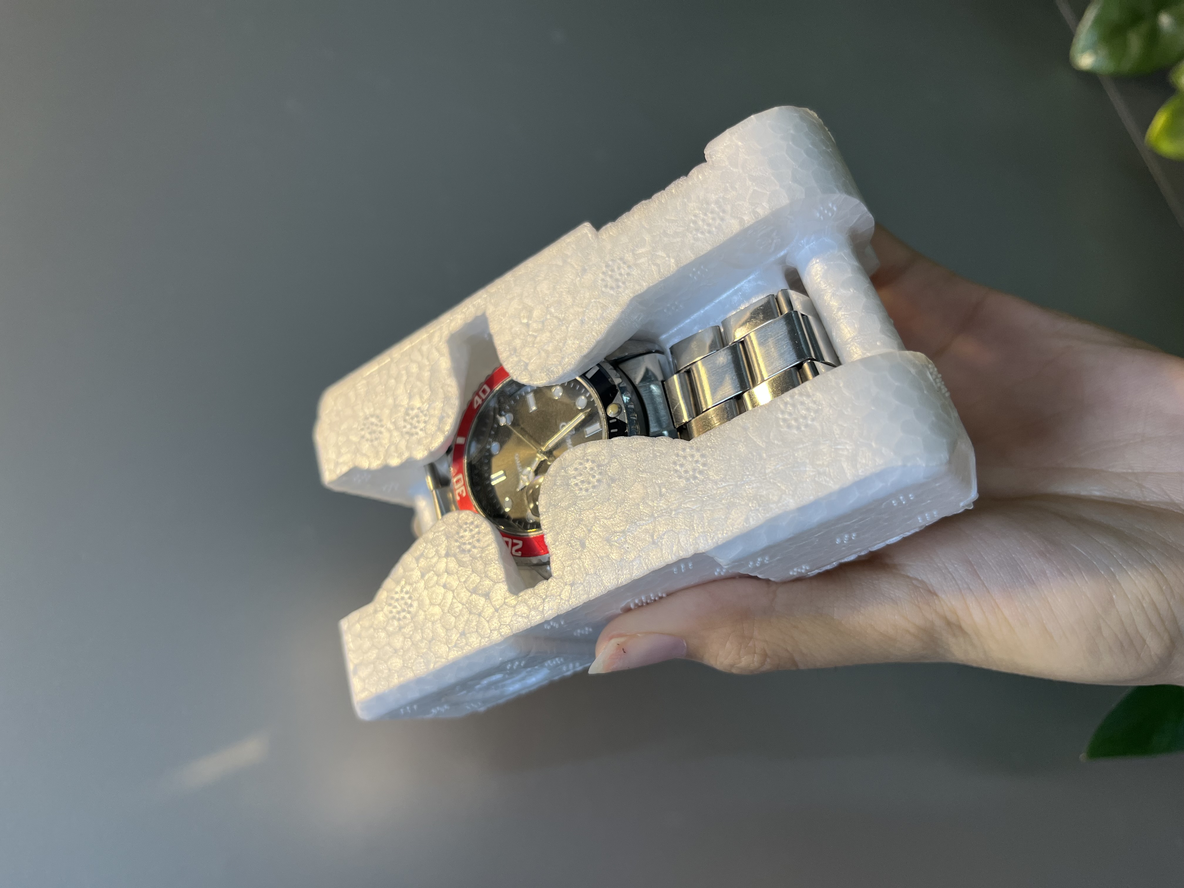 Snap-lock hinge and side clips of a clear hard acrylic watch box.JPG
