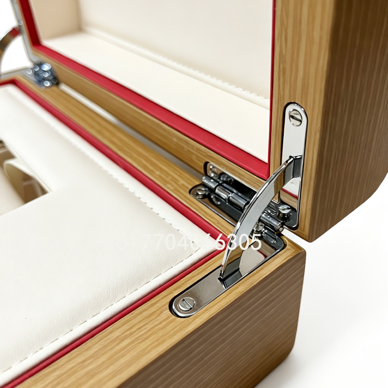 Closeup of metal hinge and wood grain finish of wooden watch box.jpg