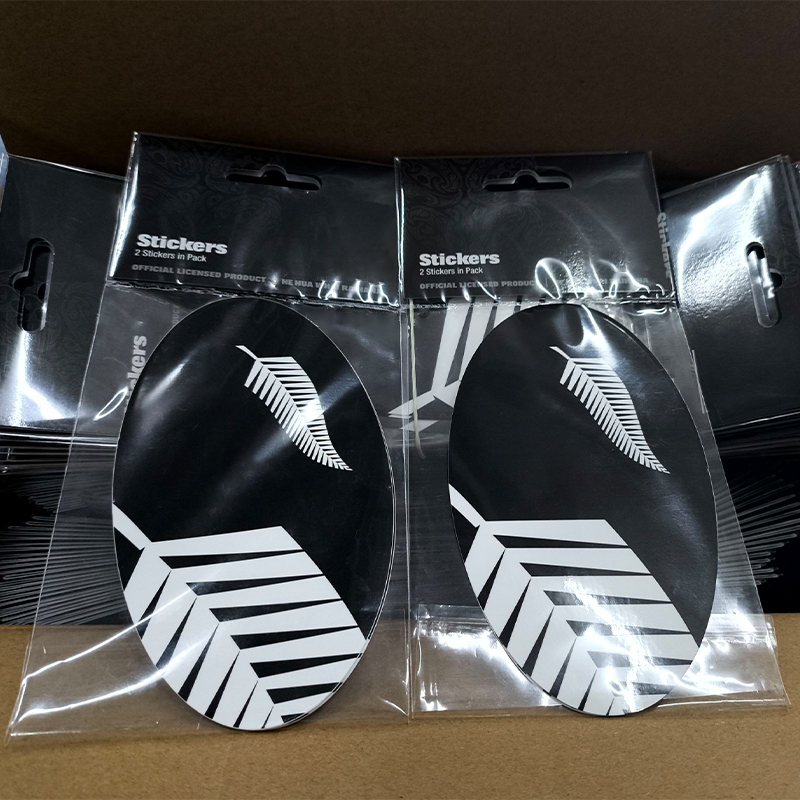 Finished custom sticker packs with printed header hang card, ready for retail sale.jpg