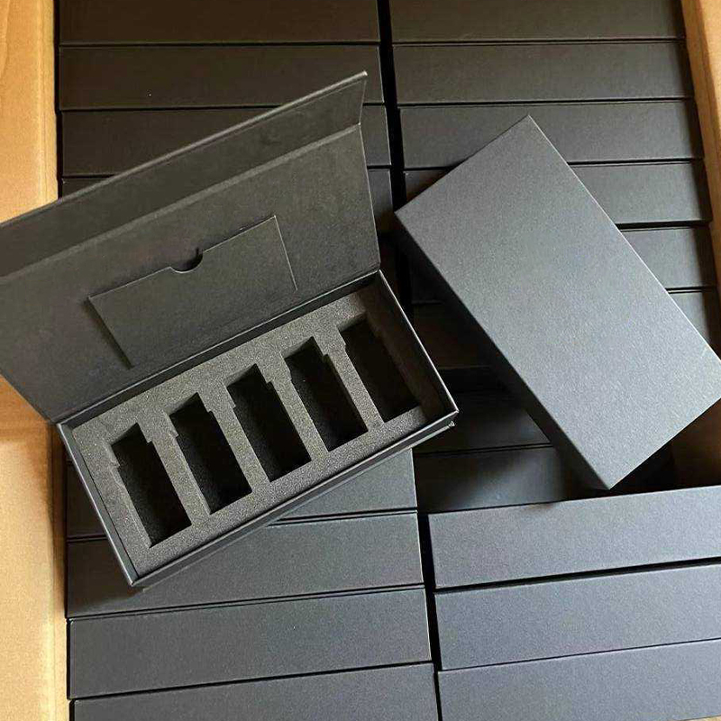 Bulk stock black rigid flip essential oil boxes stacked, open box showing 5-cavity foam insert for wholesale packaging.jpg