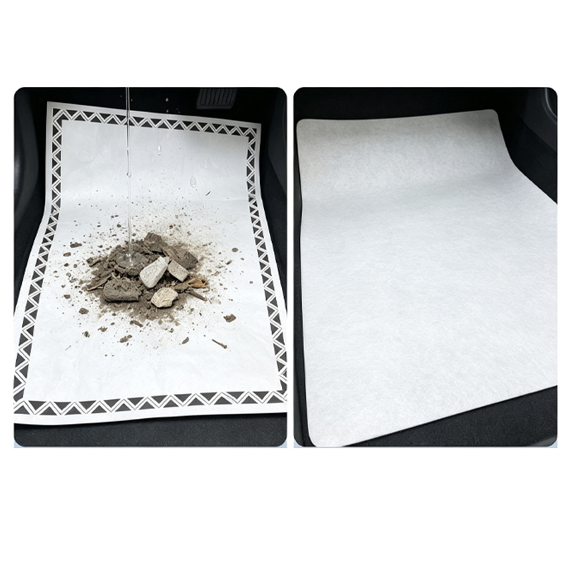 Disposable car floor mat paper real‑use test with dirt debris, blank unprinted paper sheet display inside vehicle(72549a7697).jpg