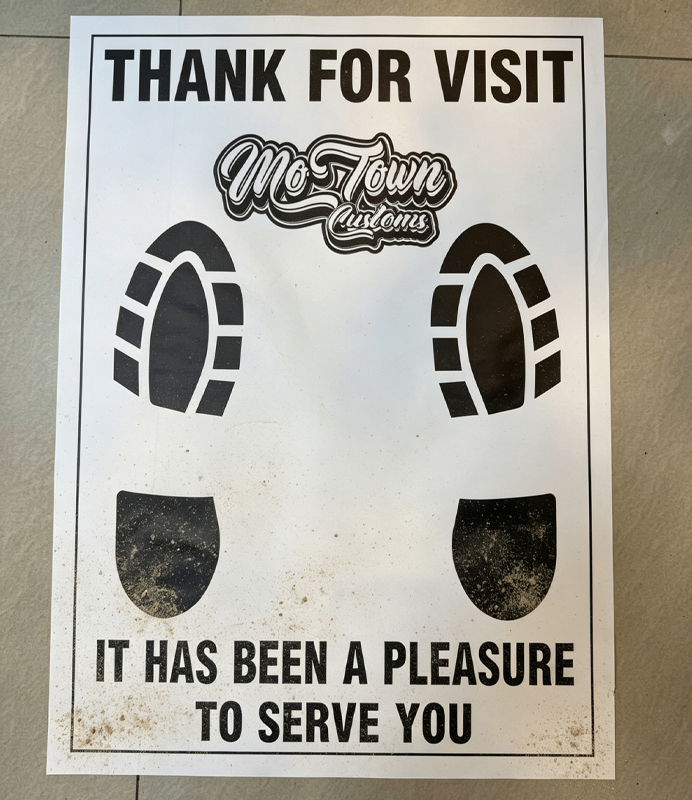 Custom logo printed disposable car floor mat paper sample with shoe footprint graphic and service slogan.jpg