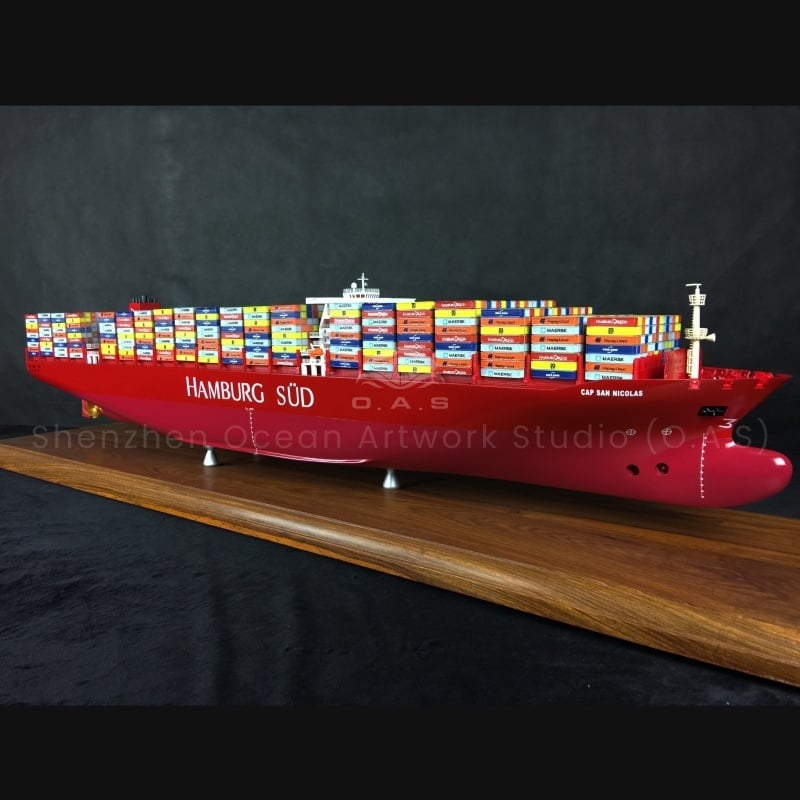 The 127cm Hamburg South American container ship model produced by O.A.S was fully developed and customized by a professional shipyard. With precise proportions and exquisite craftsmanship, the unique features of the Hamburg South American ship form are perfectly reproduced, from the solid hull to the stacked containers, every detail is brought to life. Support personalized customization, integrate enterprise elements, whether it is enterprise display, business gifts, highlight extraordinary style.Amber@vesselmodel.com Tel: +86 18038048785