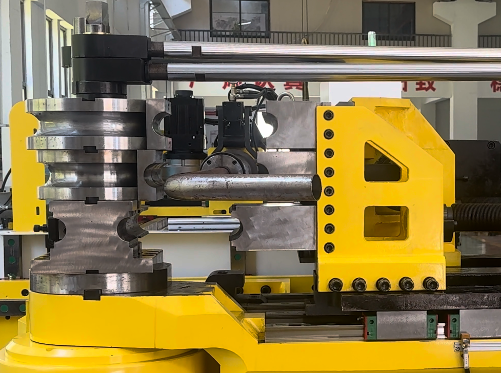 The 89CNC fully automatic pipe bending machine is designed for 3D forming of automotive exhaust pipes and large-diameter tube components. It supports draw bending and roll bending for round and rectangular tubes, with PLC and multi-axis control for feeding, rotation, bending and tooling adjustment. Suitable for efficient and consistent batch production.
