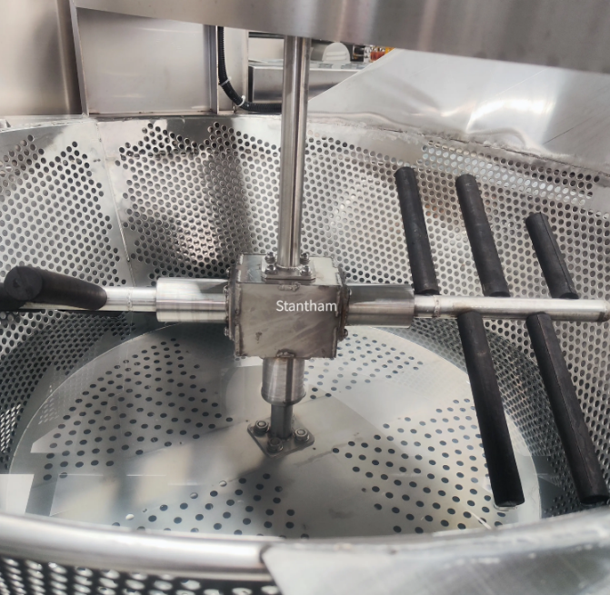 Why is proper scalding temperature critical for feather removal efficiency in a chicken abattoir?
