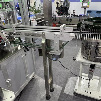 Full automatic lip gloss filling,capping,weighing,labeling & cartoning machine16.jpg