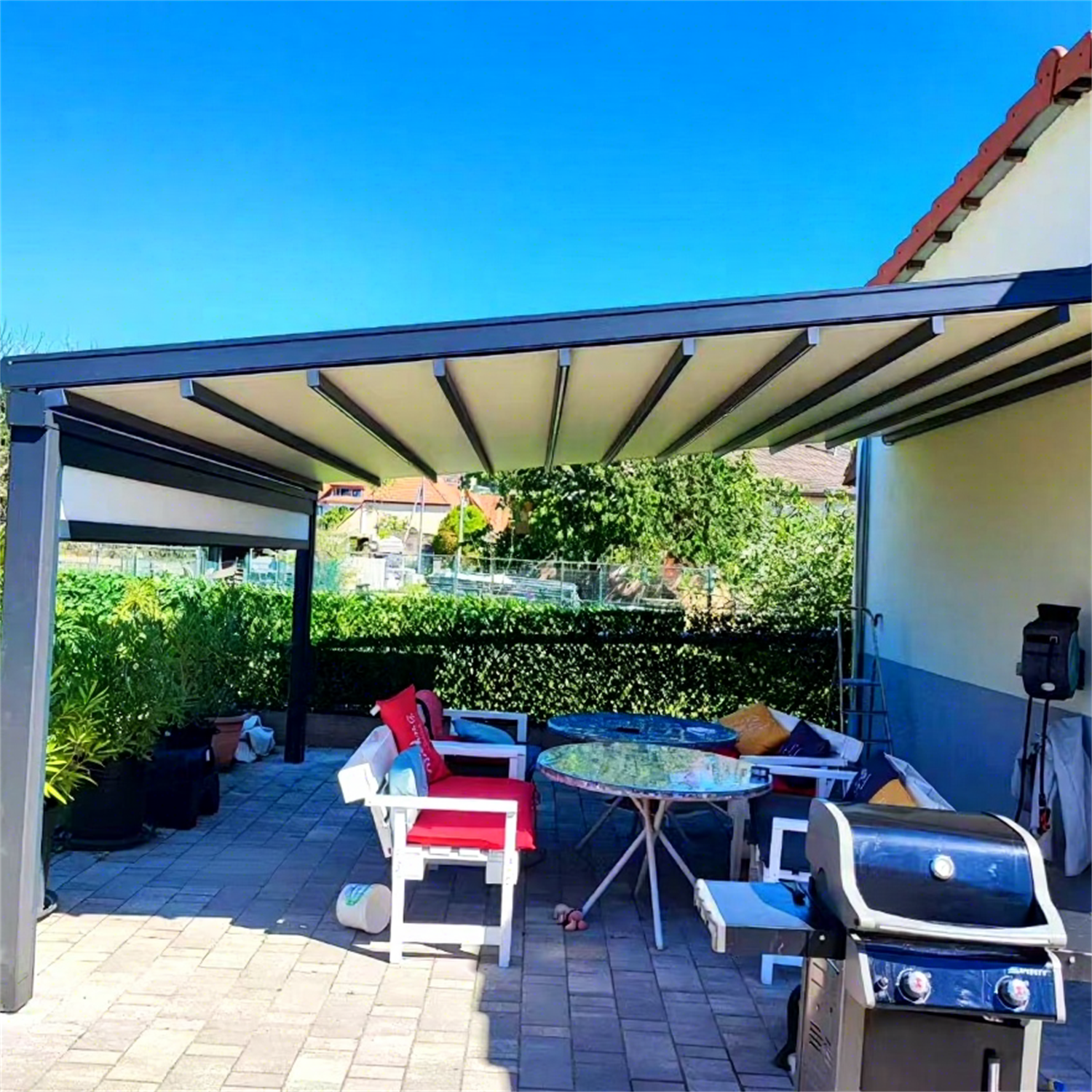 Modern French Garden Living: Wall-Mounted Retractable Fabric Awning Pergola in France