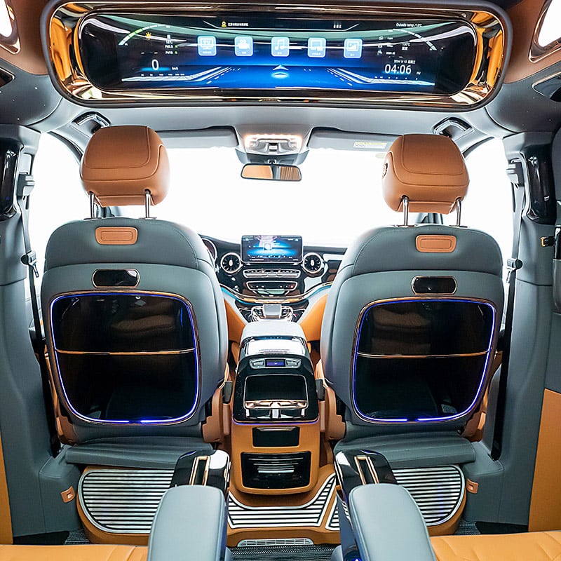 Electrically folding rear seatback table