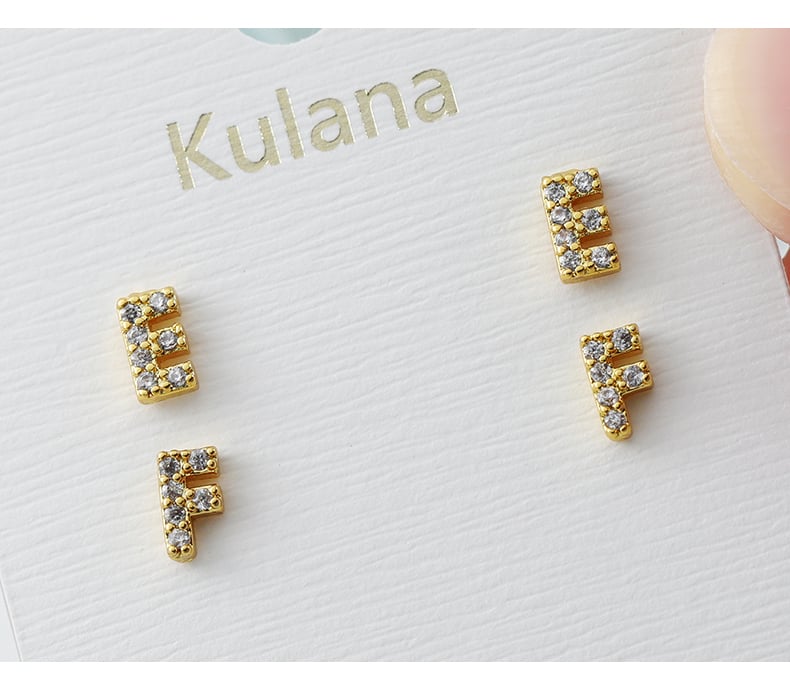 Letter stud earrings on transparent background.jpg