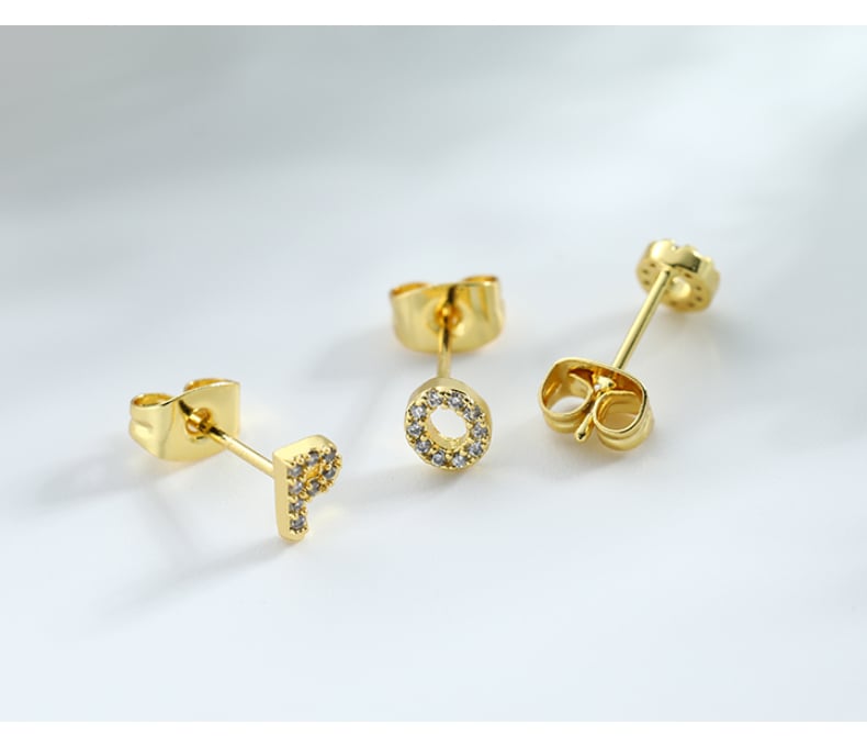 Letter stud earrings on transparent background.jpg